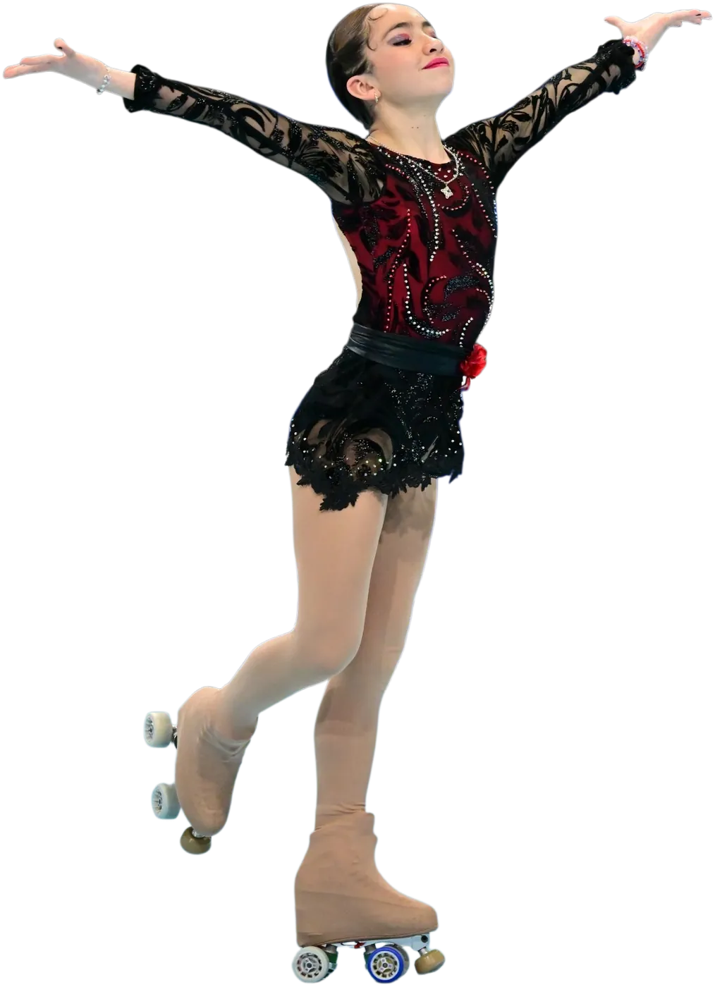 Agustina en una pose de patinaje artístico con malla roja y negra